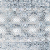 Close-up of the Askeaton Washable Area Rug, featuring a geometric diamond pattern in blue, gray, and light gray hues. Design-Rectangle-537