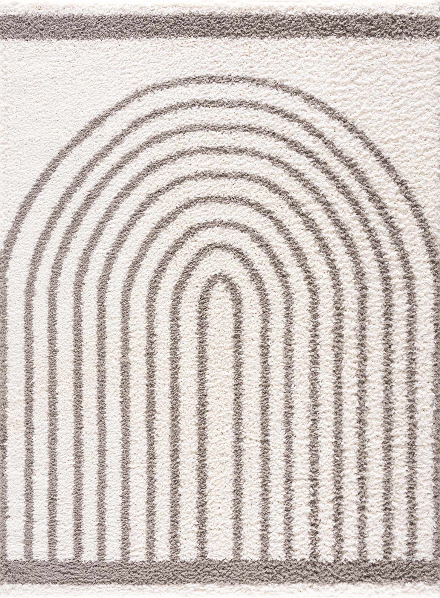 Close up of the Jola Taupe Area Rug showing a geometric rainbow pattern in taupe on a textured, off-white shag pile. Design-Rectangle-537