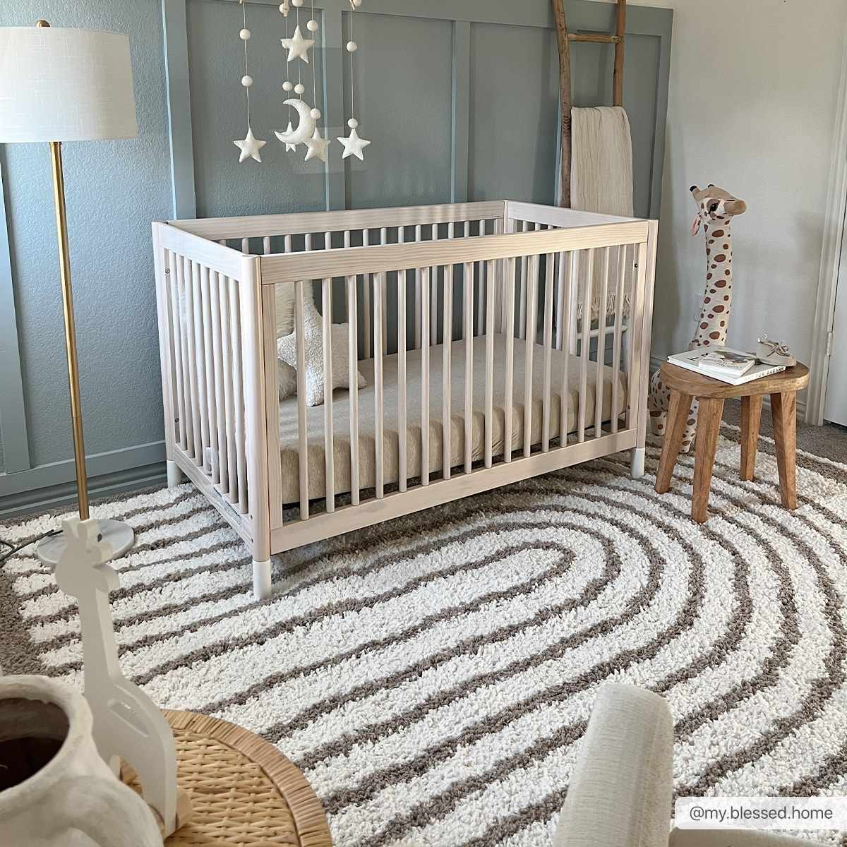 Nursery with white crib on Jola Beige Area Rug. Modern geometric rug in neutral tones. Roomscene-Rectangle