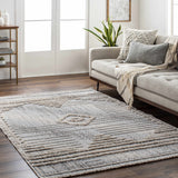 Living room scene with a gray sofa and the geometric Calituban Area Rug on a dark wood floor. Roomscene-Rectangle