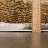 Close-up of the plush texture and pile height of the Canika Green Checkered Washable Rug. Pile