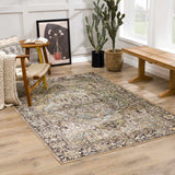 Sunlit living room with a Neyland Sage Green Area Rug, wood floors, chair, bench, and cacti. Roomscene-Rectangle