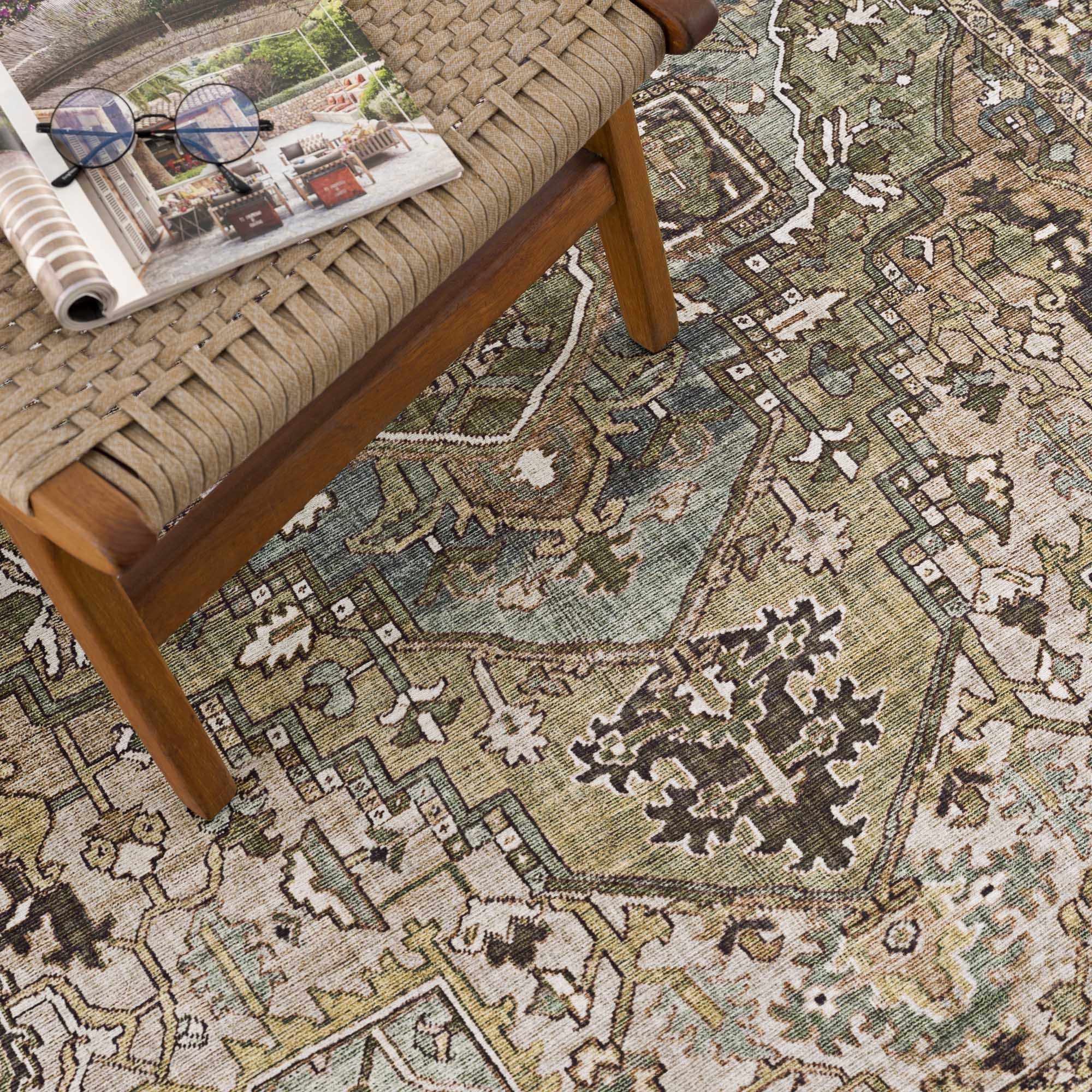 Close-up of the Neyland Sage Green Area Rug showing its traditional oriental pattern and texture, with sage, olive, and cream colors. Styleshot