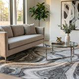 Living room scene with a gray sofa and the Itotia Marble Green Area Rug with a swirling marble pattern. Roomscene-Rectangle