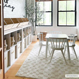 Kids room scene with white table and chairs on Keesa Checkered Area Rug. Ivory rug in a bright, contemporary space. Roomscene-Rectangle