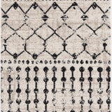 Close-up of the Joppatowne Washable Area Rug featuring a black geometric pattern on a cream and light beige background. Design-Runner-2773
