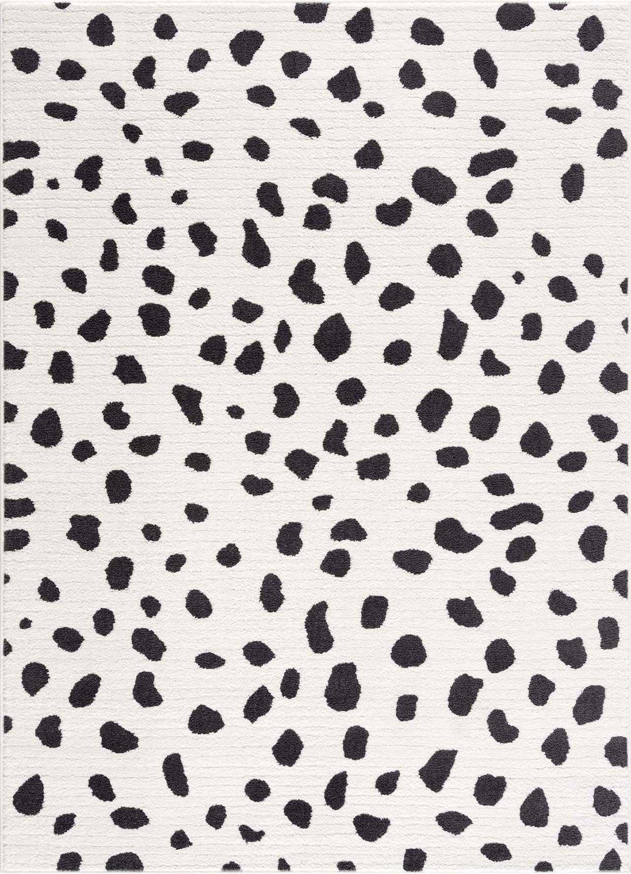 Close-up of the Tariffville Dalmatian Rug, featuring a black and charcoal spot pattern on an off-white background. Design-Rectangle-5373