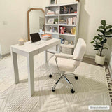 Home office with white desk, chair, and Manyas 3D Bone Area Rug. Geometric rug with tassels adds texture to the neutral room. Roomscene-Rectangle