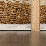 Close-up of the plush texture and pile height of the Manyas 3D Bone Area Rug, measured with a ruler. Pile