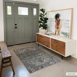 Entryway with Neyland Sage Green Area Rug, wood bench, sage door, and horse art above a wood and white console. Roomscene-Rectangle