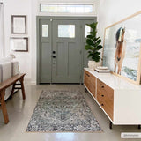 Entryway with a Neyland Sage Green Area Rug, wooden bench, and modern white and wood console table. Roomscene-Rectangle