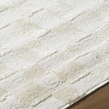 Close up of the Keesa Checkered Area Rug. Ivory and off-white tones with a subtle checkered pattern and soft texture. Texture