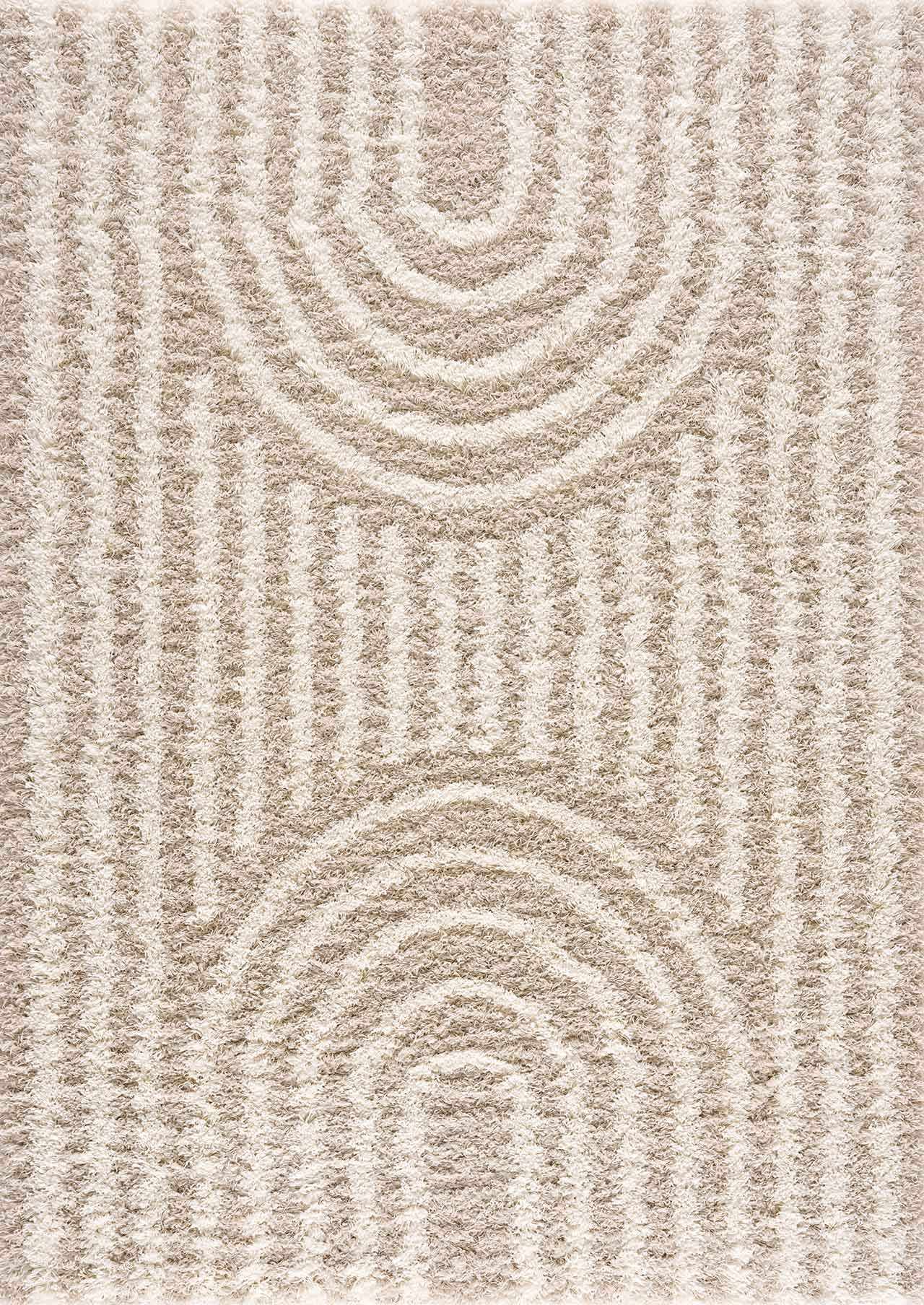 Close-up of the Emmly Shag Area Rug. Shag rug with a geometric pattern in white thatch, light peach, and nutmeg hues. Design-Rectangle-5373