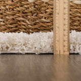 Close up of the Emmly Shag Area Rug showing the pile height with a ruler. Pile