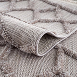 Close-up of the gray Borbon Area Rug showing geometric pattern and woven texture. Fold