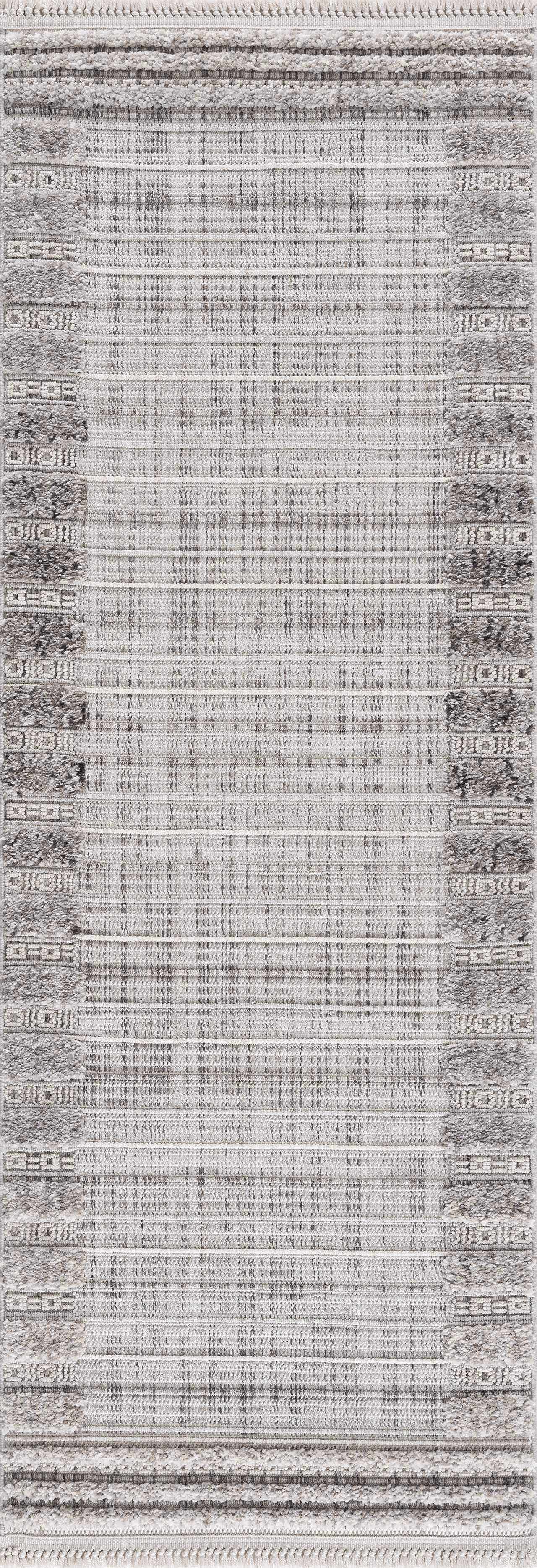 Close-up of the Naivasha Elegant High/Low Area Rug. Charcoal, cream, and gray rug with a textured, striped, bohemian design. Design-Runner-2773