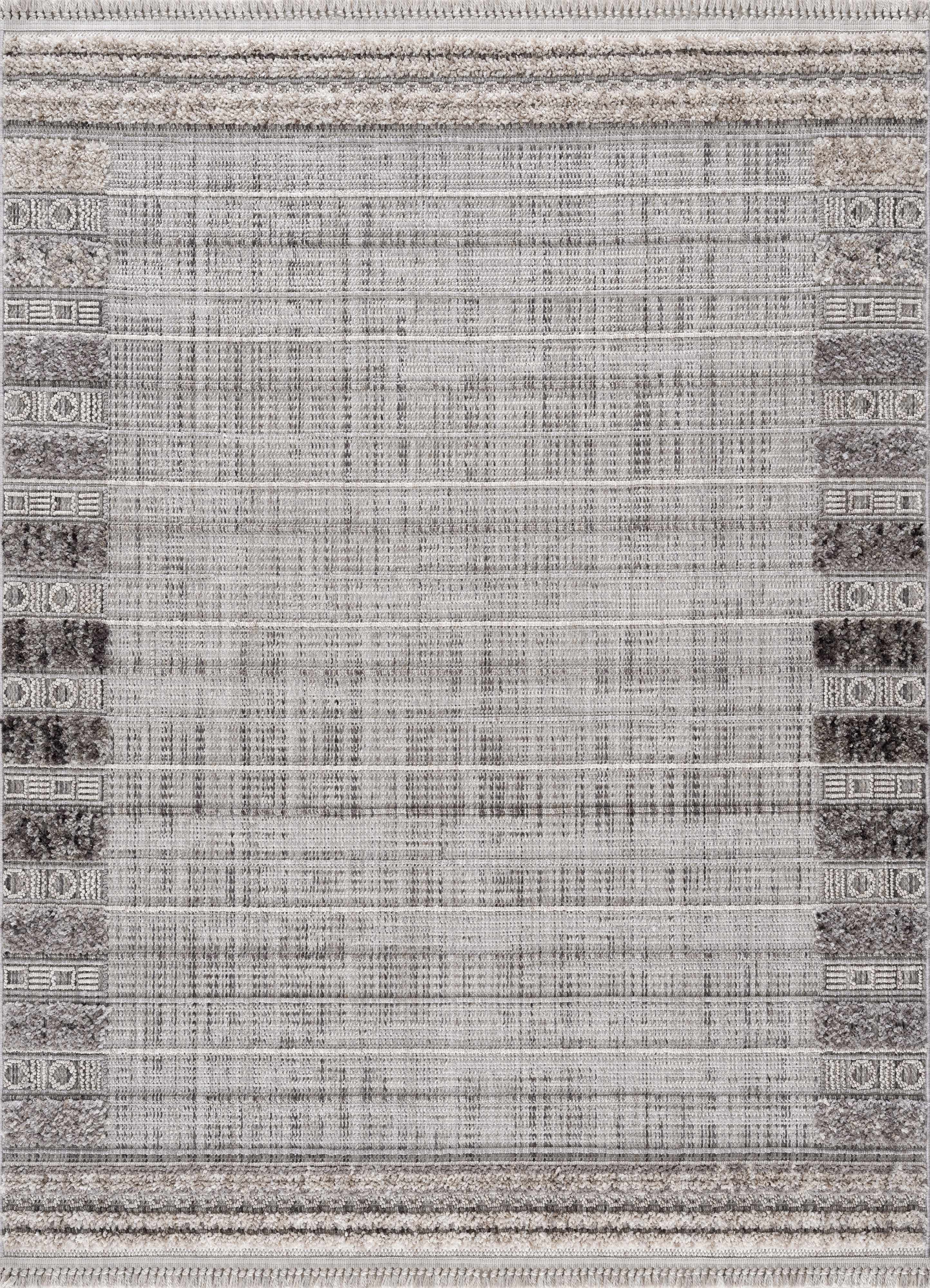 Close-up of the Naivasha Elegant High/Low Area Rug featuring charcoal, cream, and gray tones with a textured, geometric pattern. Design-Rectangle-537