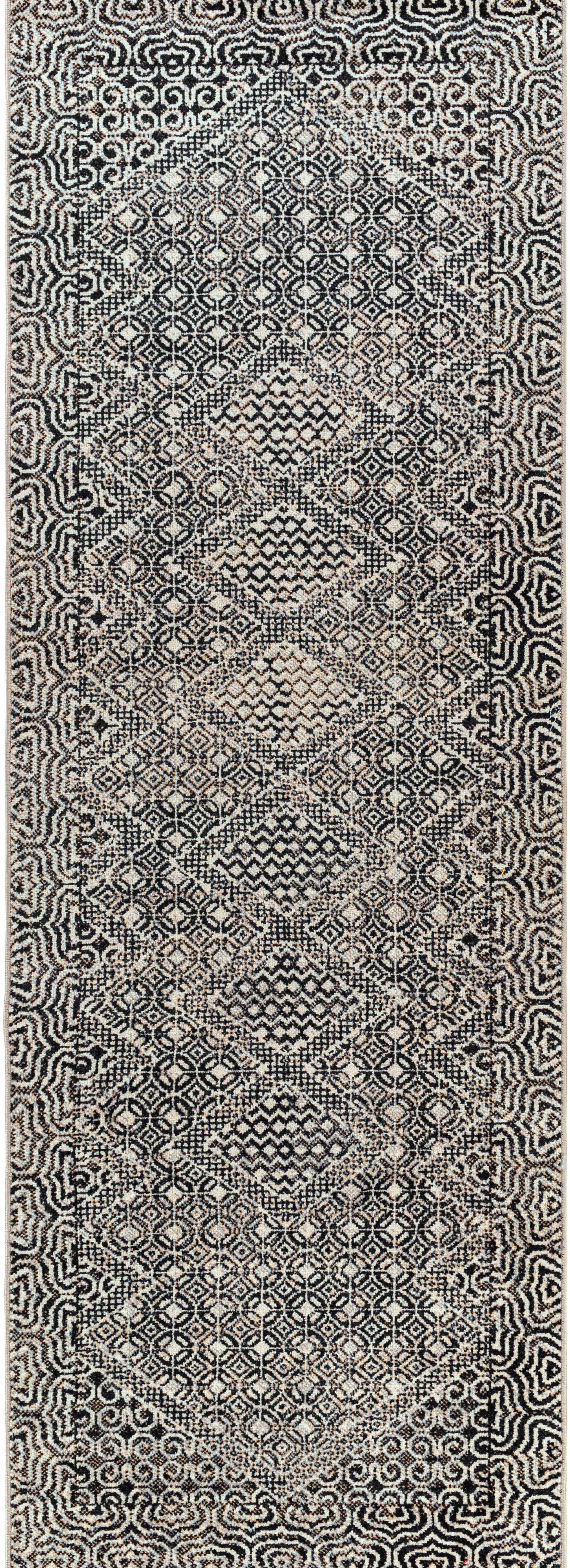 Close-up of the Consuelo Washable Area Rug, showcasing its black, gray, and light gray oriental-inspired geometric pattern. Design-Runner-2773