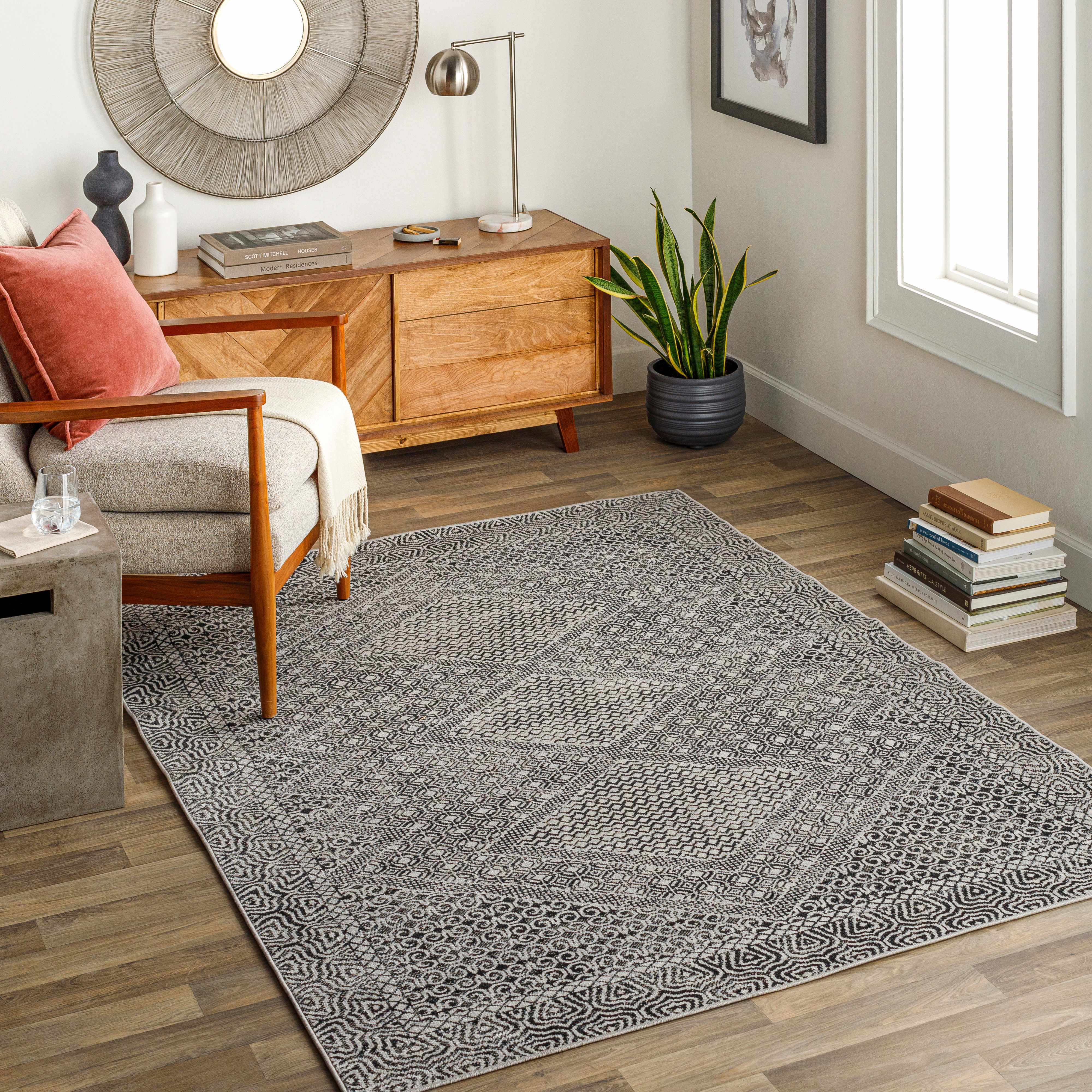 Living room scene with gray Consuelo Washable Area Rug, wood floors, mid-century modern furniture, and neutral decor. Roomscene-Rectangle