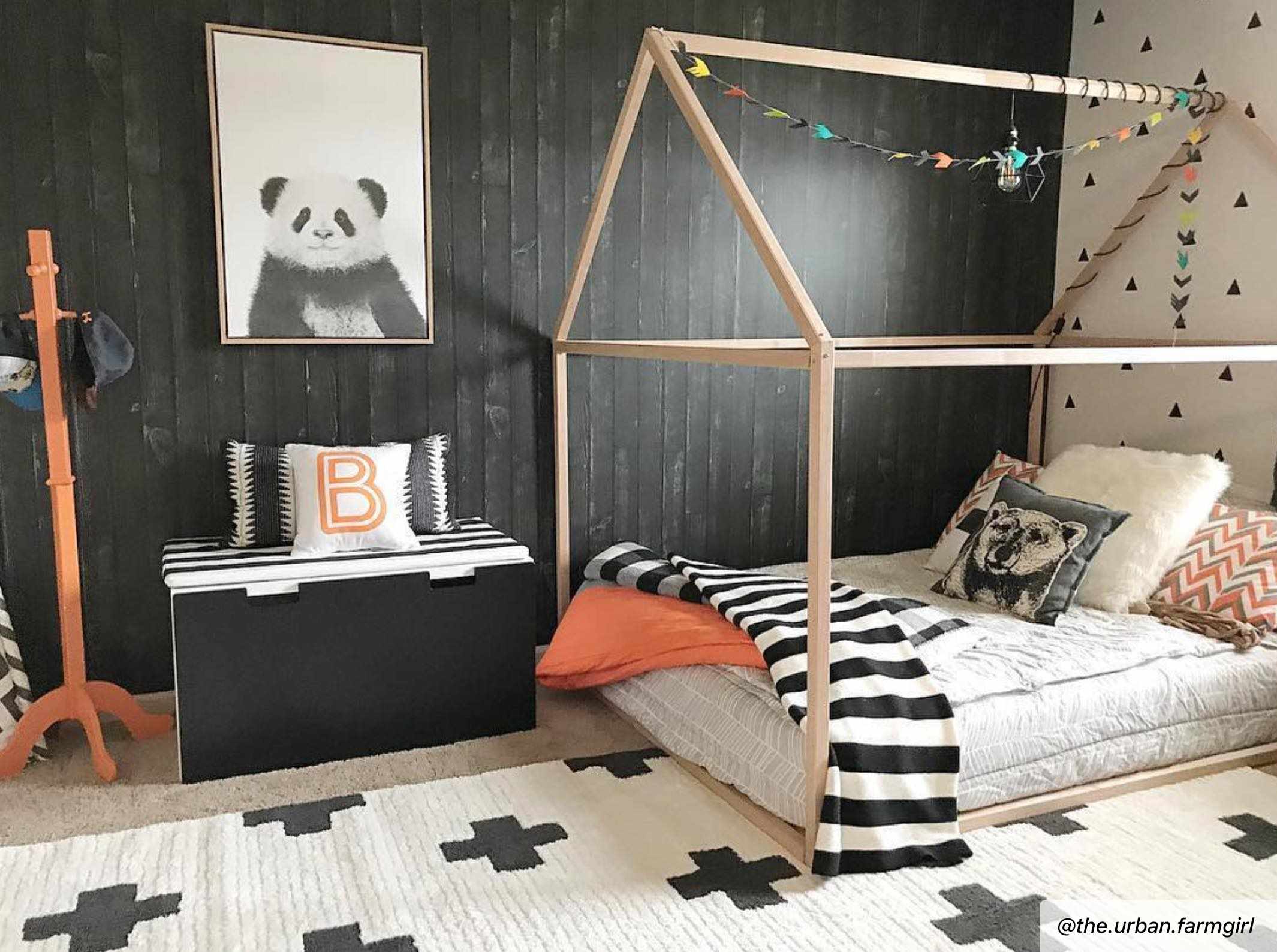 Kids room with Erath Area Rug in off-white and black, plus sign pattern. Styled with a wooden bed frame and panda wall art. Roomscene-Rectangle