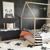 Kids room with Erath Area Rug in off-white and black, plus sign pattern. Styled with a wooden bed frame and panda wall art. Roomscene-Rectangle