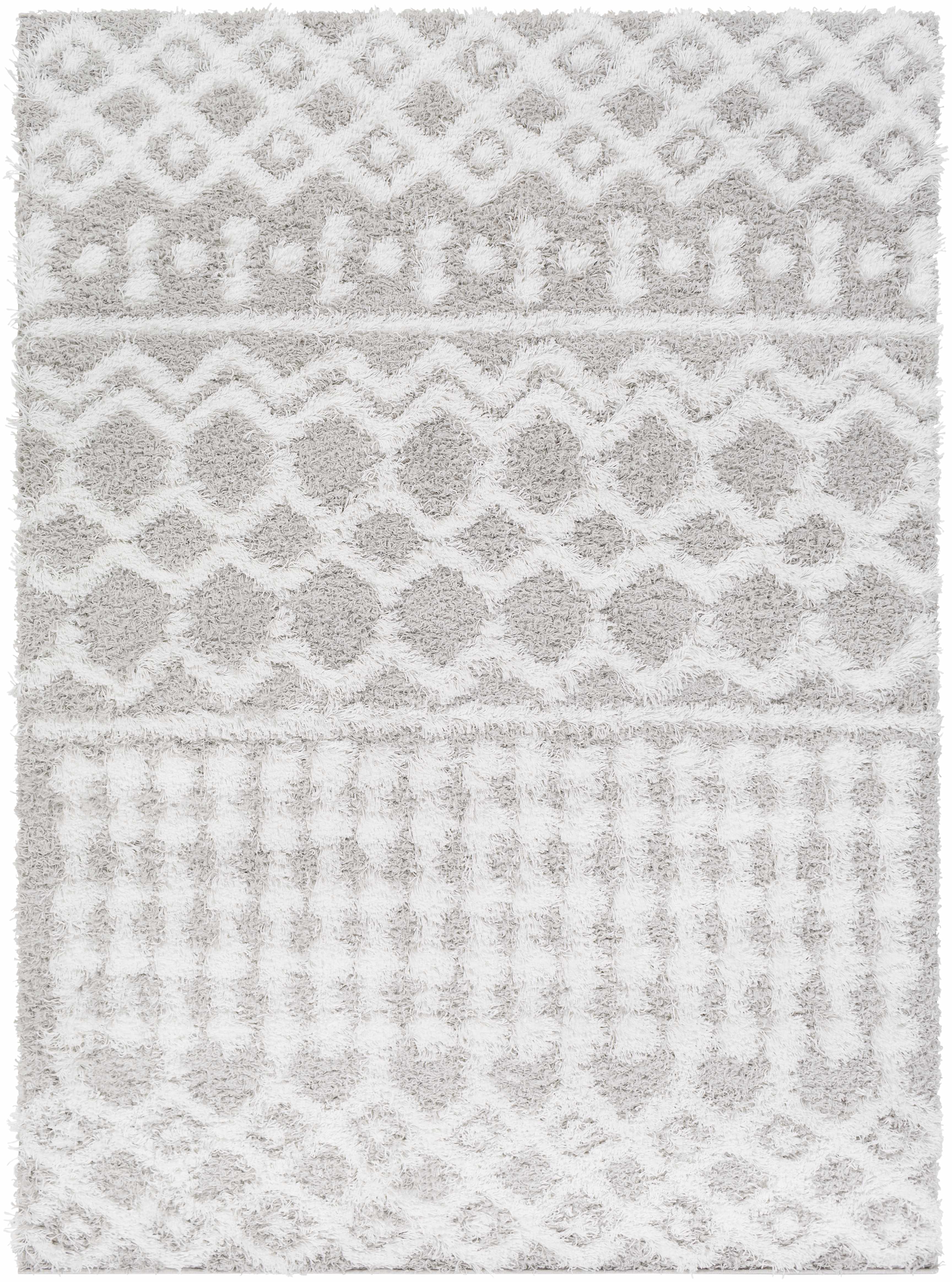 Close-up of the Vernonburg Shag Area Rug. Light gray and white shag rug with geometric diamond and zig-zag pattern. Soft texture. Design-Rectangle-5373
