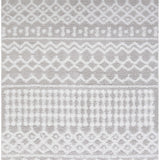 Close-up of the Vernonburg Shag Area Rug, a soft, machine-woven rug with light gray and white geometric patterns. Design-Rectangle-710103