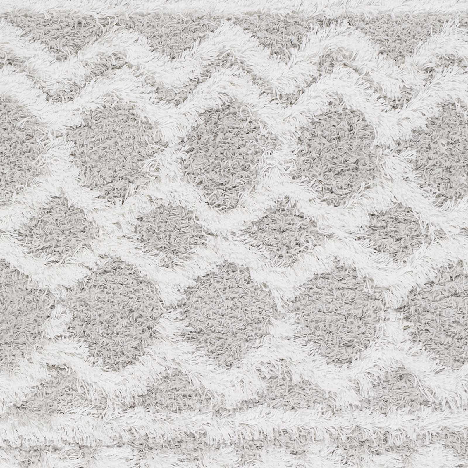 Close-up of the Vernonburg Shag Area Rug, showcasing its light gray and white geometric pattern and soft, shaggy texture. Swatch