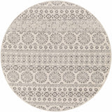 Close-up of a round Warroad Area Rug. Charcoal and gray floral and geometric pattern on light beige background. Design-Round-67