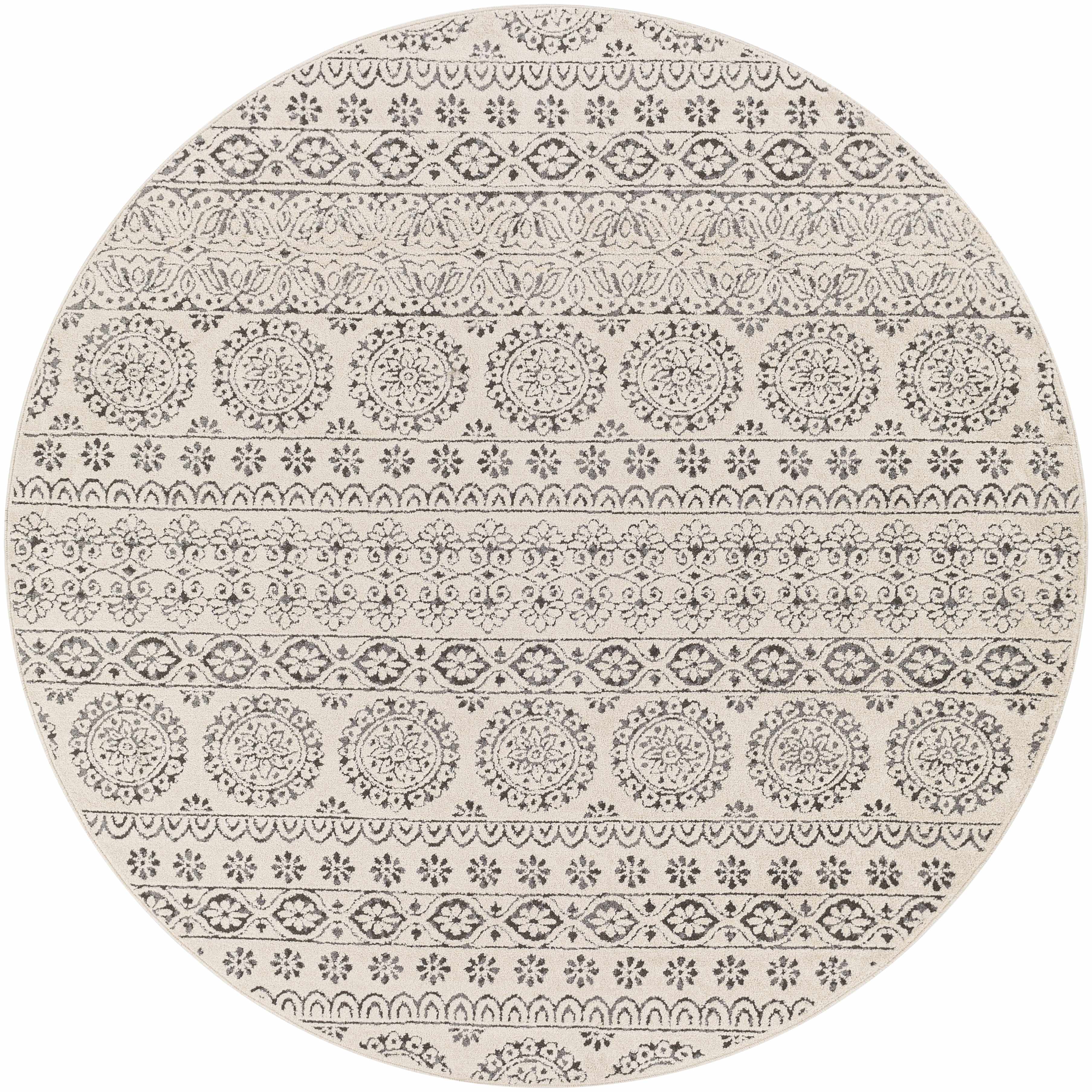 Close-up of a round Warroad Area Rug. Charcoal and gray floral and geometric pattern on light beige background. Design-Round-67